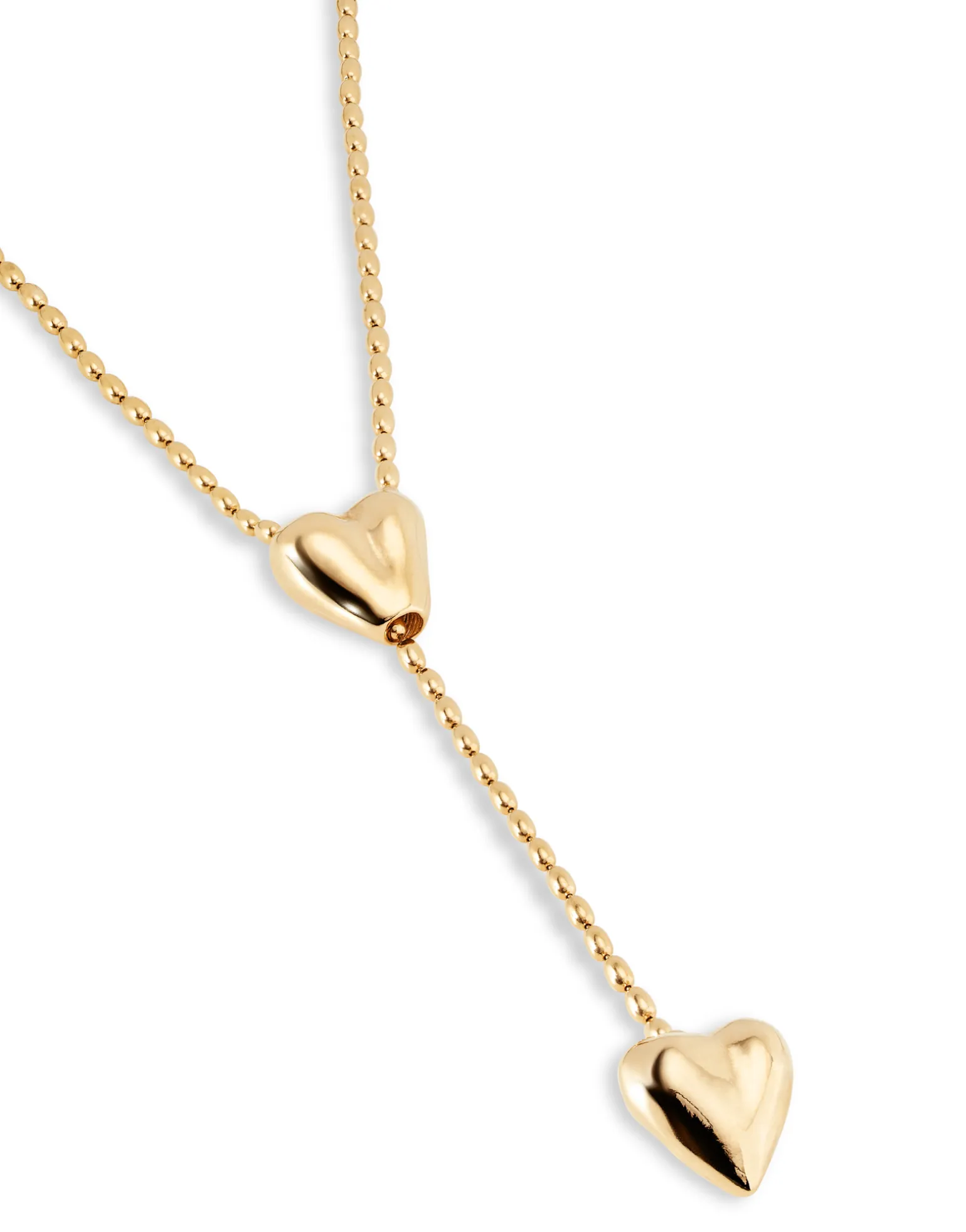 Cadena bañada en oro 18k con dos corazones, uno ajustable en el centro.