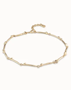 Collar bañado en oro de 18k con piezas en forma de clavo.