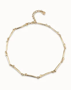 Collar bañado en oro de 18k con piezas en forma de clavo.