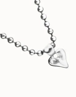 Collar con bolas bañado en plata de ley y detalle de corazón