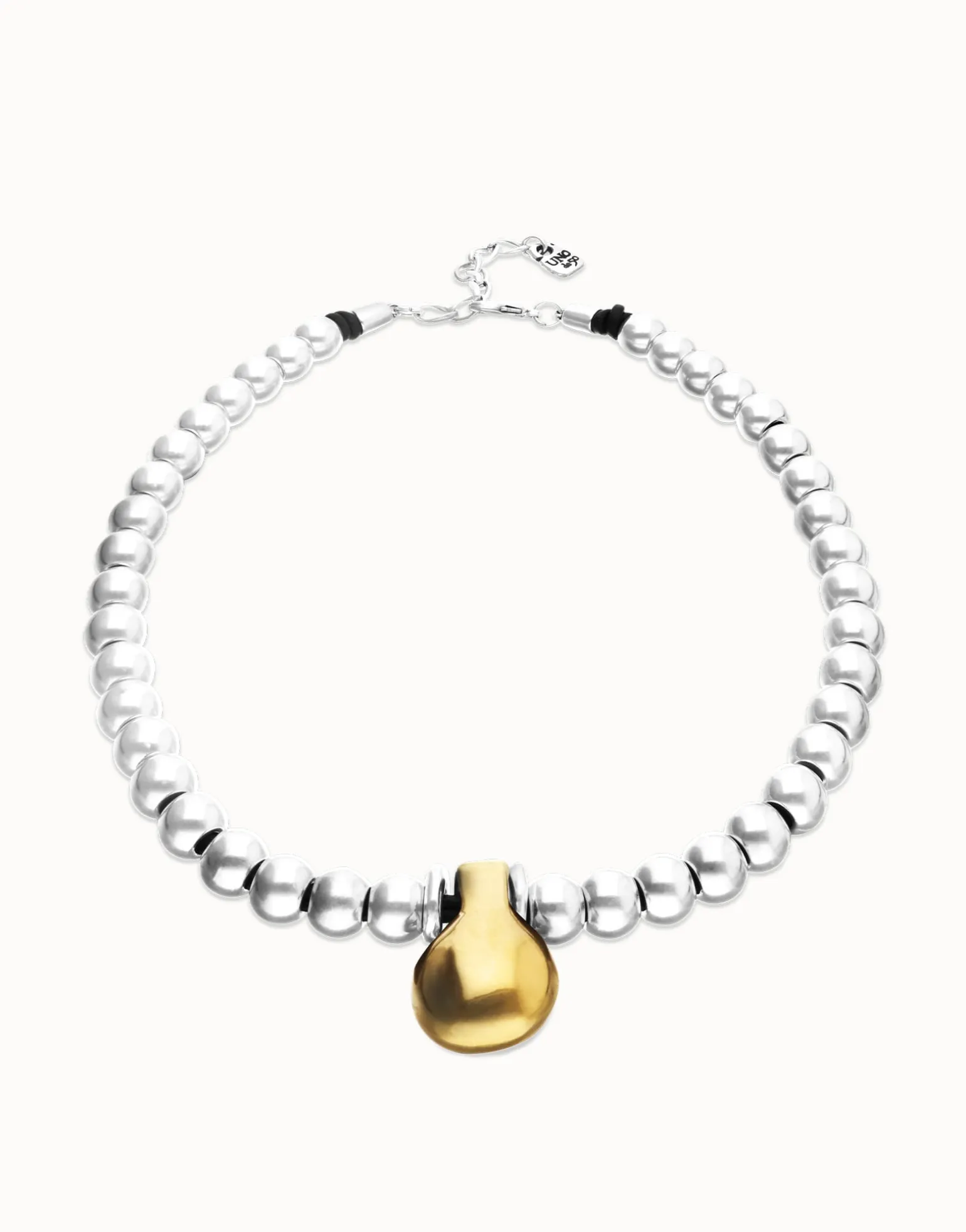 Collar de esferas medianas bañadas en plata de ley y esfera grande en oro 18k