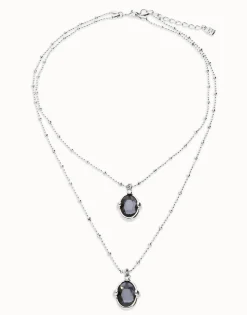 Collar doble bañado en plata con dos cristales facetados ovalados negros