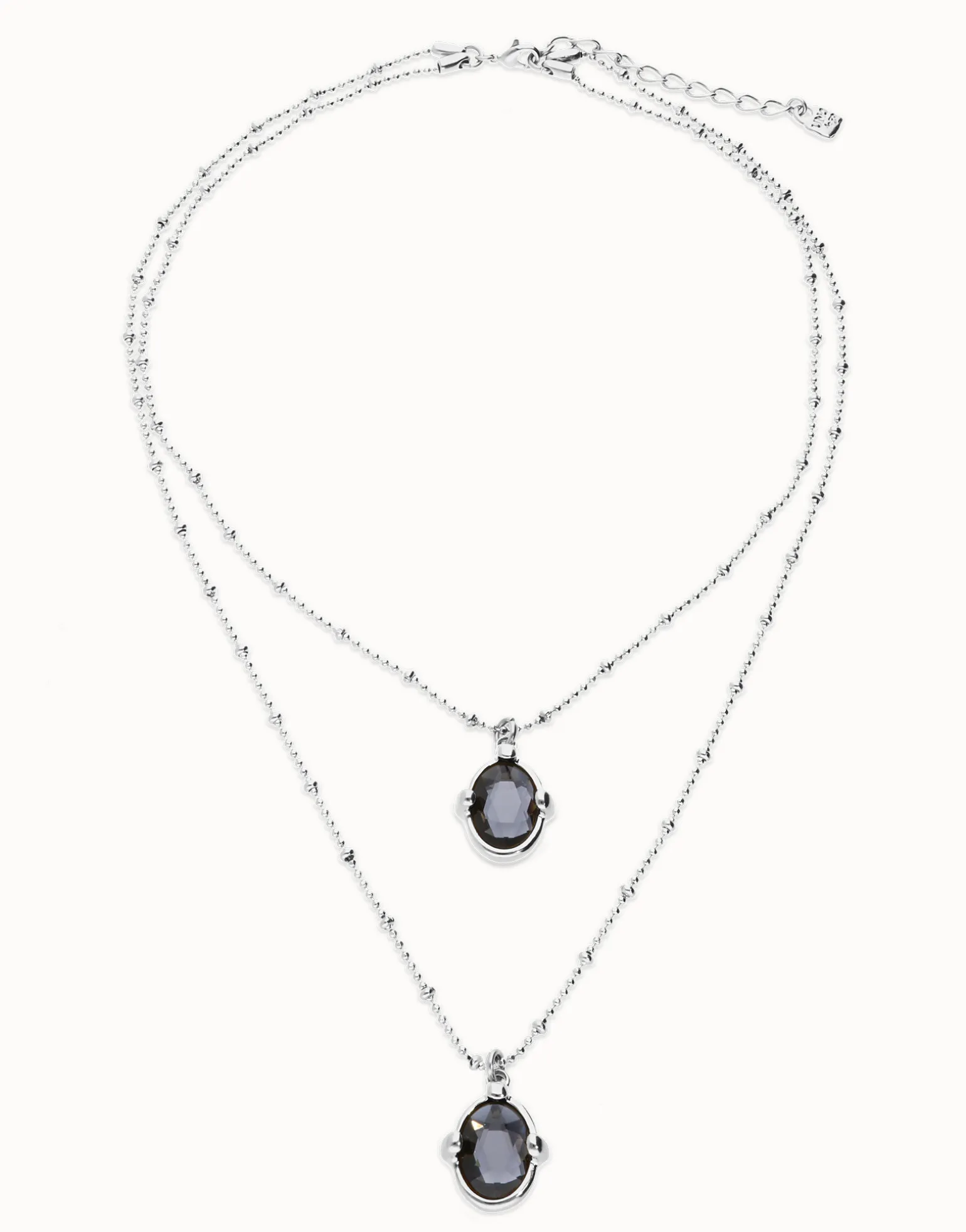 Collar doble bañado en plata con dos cristales facetados ovalados negros