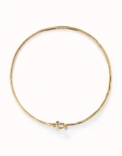 Collar rígido con cierre frontal bañado en oro 18k con topacio blanco