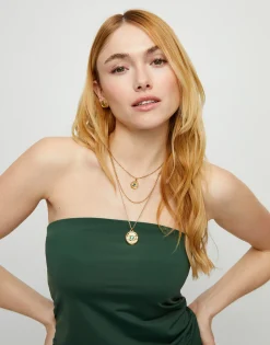 Collar triple bañado en oro 18k con charms de ojo y cristal facetado verde