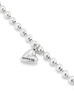 Pulsera bañada en plata de ley con bolas y charm de corazón
