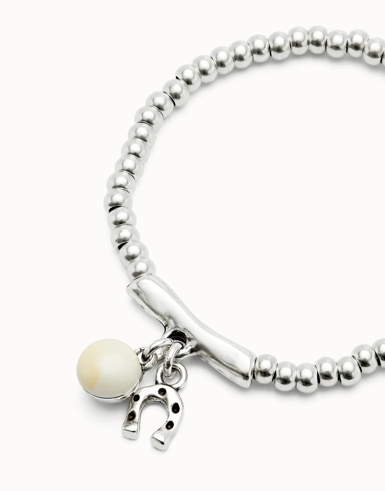 Pulsera bañada en plata de ley y cristal de murano marfil y herradura