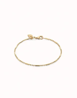 Pulsera con bolas y piezas alargadas bañada en oro 18k