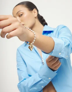 Pulsera de bolas bañada en oro 18k con detalle de corazón