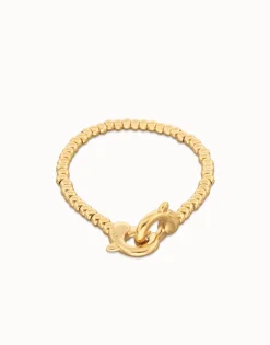 Pulsera de bolas pequeñas bañada en oro con mosquetón entrelazado