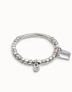 Pulsera de cuentas, pieza tubular y chapa con mensaje bañado en plata