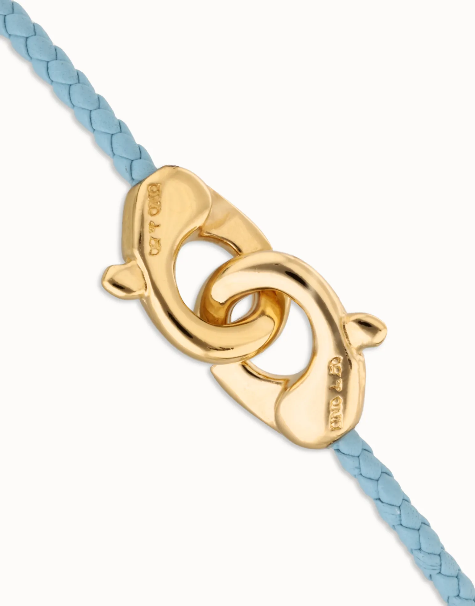 Pulsera de cuero azul con mosquetón entrelazado en oro