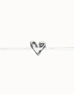 Pulsera de cuero blanco con detalle de corazón bañado en plata de ley