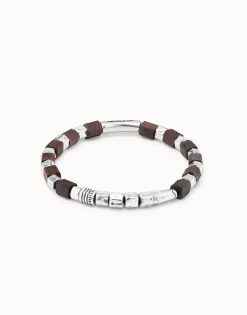 Pulsera de cuero con piezas bañadas en plata de ley y cuentas de madera