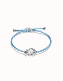 Pulsera de hilo azul con perla shell fornitura bañada en plata de ley.