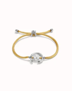 Pulsera de hilo camel con perla shell fornitura bañada en plata de ley.