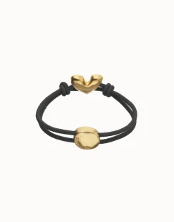 Pulsera de hilo elástico negro con corazón bañado en oro 18k