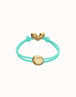 Pulsera de hilo elástico turquesa con corazón bañado en oro 18k