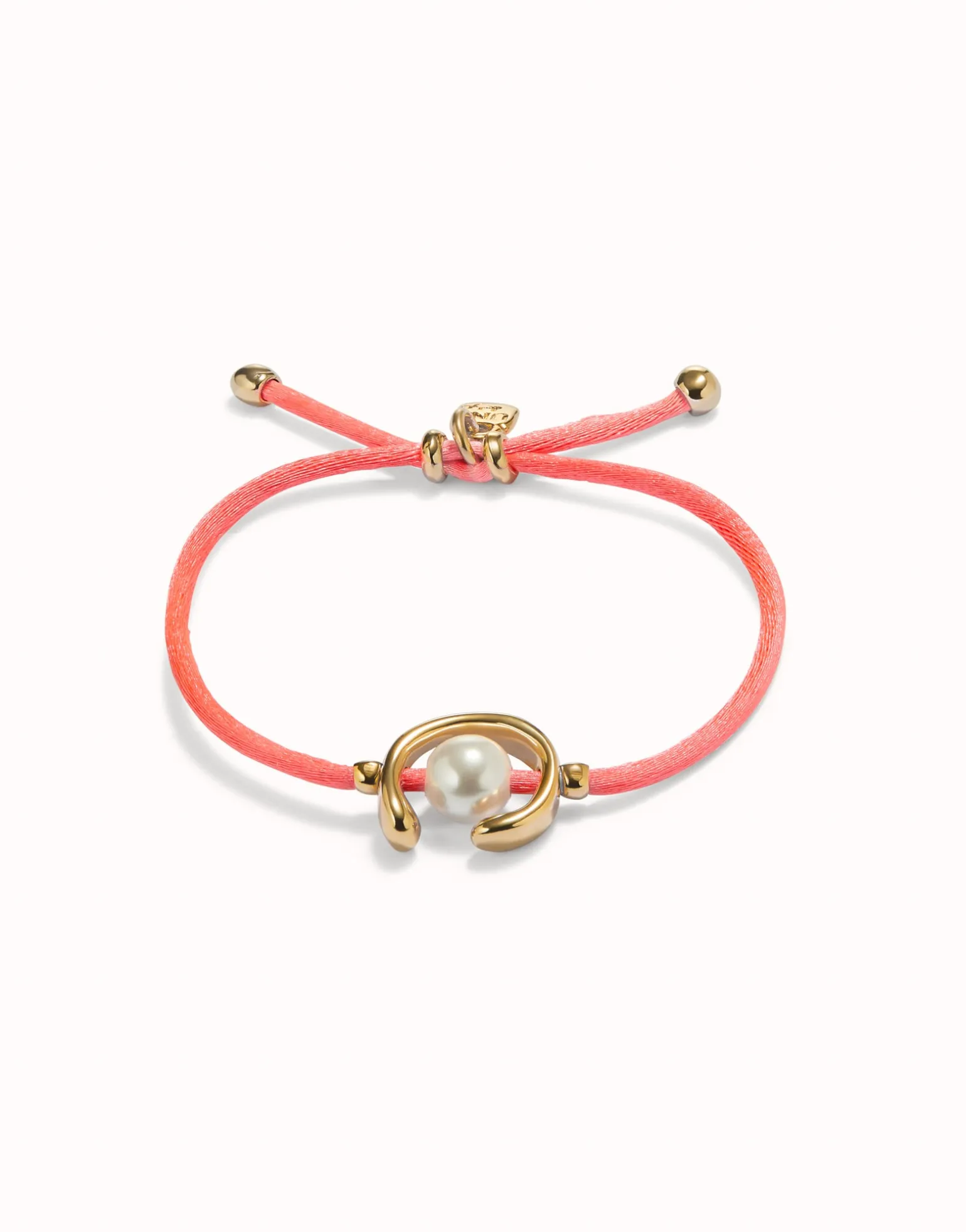 Pulsera de hilo fucsia con perla shell fornitura bañada en oro 18k.