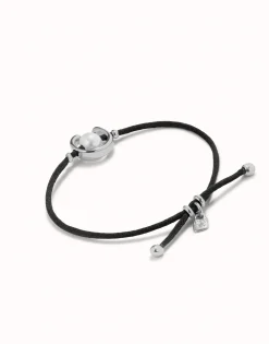 Pulsera de hilo negro con perla shell fornitura bañada en plata de ley.