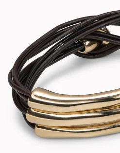 Pulsera de tres vueltas de cuero y detalles bañados en oro de 18k