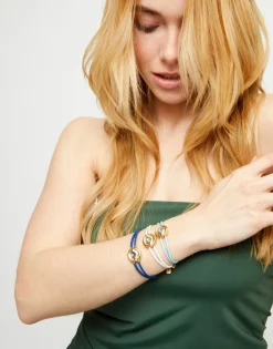 Pulsera doble de cuero blanco con ojo bañado en oro 18k