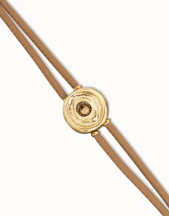 Pulsera doble de cuero crema con ojo bañado en oro 18k