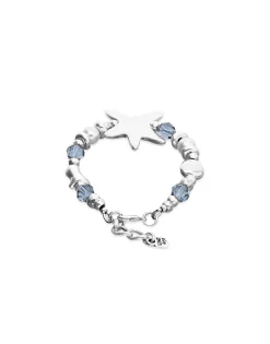 Pulsera elástica bañada en plata con cristales azules y estrella de mar