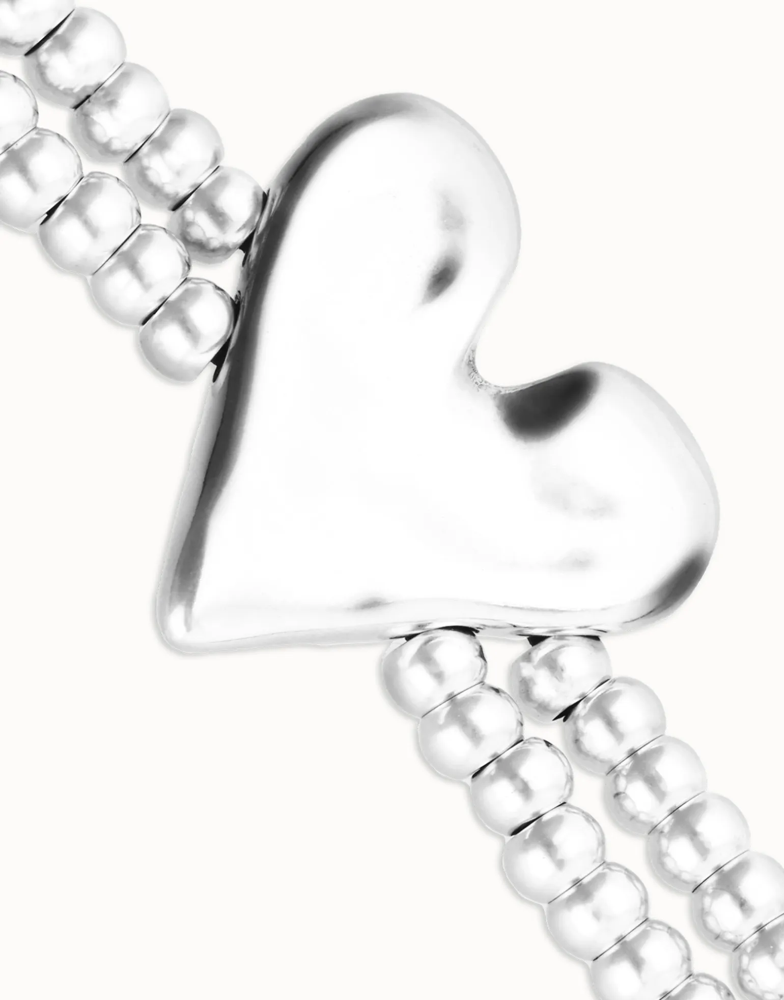 Pulsera elástica doble bañada en plata de ley con detalle de corazón