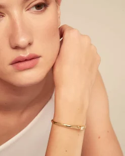 Pulsera rígida bañada en oro 18k con circonita blanca