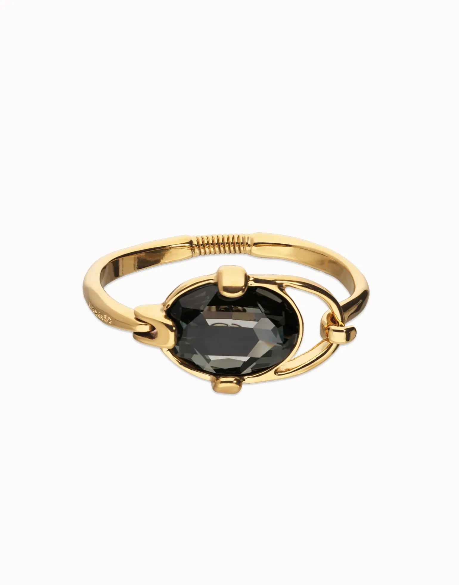 Pulsera rígida bañada en oro 18k con cristal facetado ovalado gris