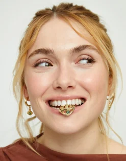 Anillo bañado en oro 18k en forma de ojo con cristal facetado verde
